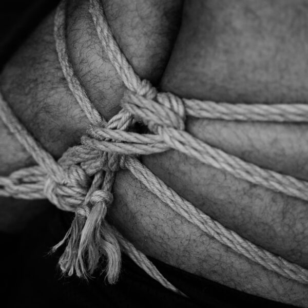 grayscale photo of rope tied on rope